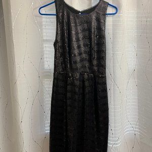 Black sequin dress with wavy pattern and open back